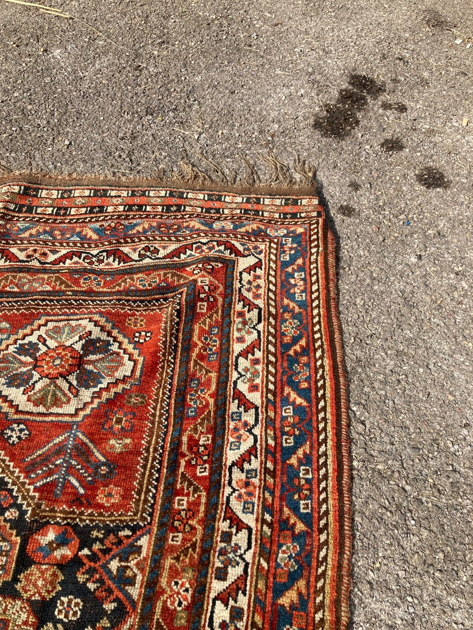 An early 20th century Persian blue ground rug, having three central medallions and floral decoration, 250 x 146cm